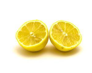Studio shot two organic fresh lemon slice cuts isolated on white