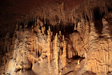 View at stalactites and stalagmites inside Mammoth Cave. Geological structures of various forms and...