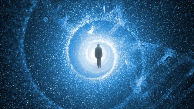 Man walks into rotating science tunnel with dna cell.