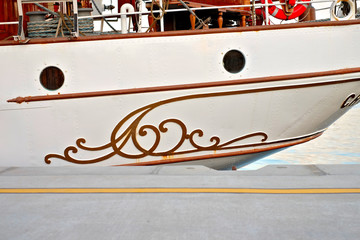 Decorative ornamental detail of a stern of a classic sailing tall ship.