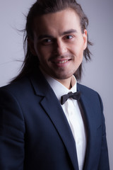 Handsome young elegant man studio portrait.