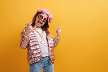 Kid on bright color background.