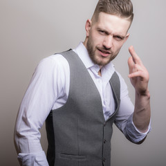 Handsome young elegant man studio portrait.
