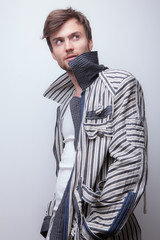 Handsome young elegant man studio portrait.