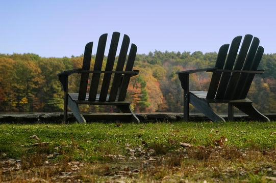 Two Adirondack Chairs In Autumn