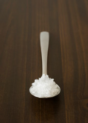 Salt on wood background
