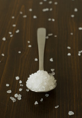 Salt on wood background