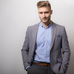 Handsome young elegant man studio portrait.