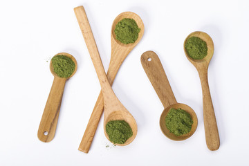 Matcha green tea powder in spoons isolated on white background creative flat lay, Organic product from the nature for healthy with traditional style