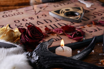Talking board and planchette, also known as Ouija board, used for communicating with the dead and...