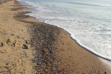 A gentle sea shore with beautiful white waves