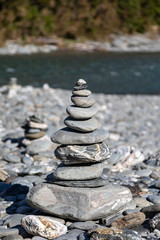 Concept of balance and harmony.  Rocks on the riverbank in New Zealand.