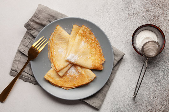French Crepe with sugar powder for Chandeleur. Top view. Copy space. Flat lay
