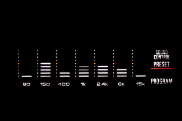 Old stereo graphic volume equalizer glowing in the dark.