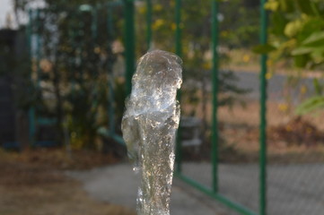 The water coming out from the pipe