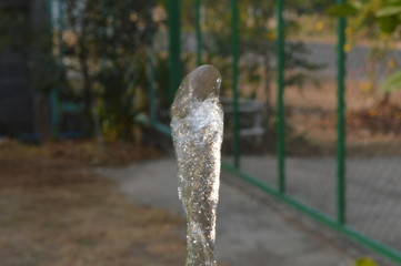 The water coming out from the pipe