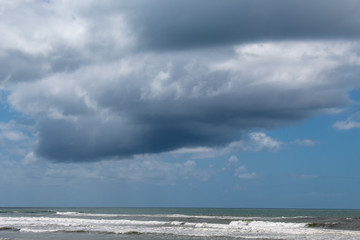 Fototapeta na wymiar Rain cloud over the sea