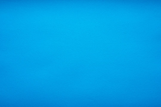 Grain light blue paint wall or red paper background or texture