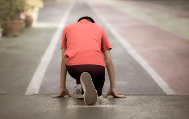 Little boy training running speed in the line at school