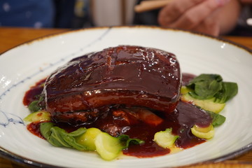 Stewed Pork with Vegetables on White Plate