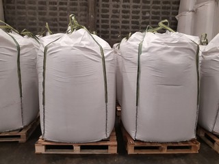 Stock pile Chemical fertilizer jumbo-bag in warehouse waiting for shipment.	
