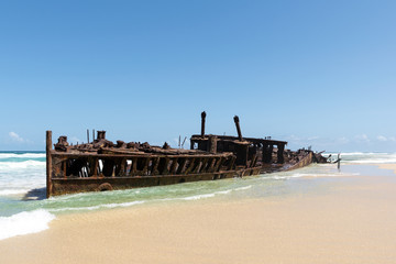 Shipwreck of SS Maheno, an ocean liner from New Zealand which ran aground on Seventy-Five Mile Beach on Fraser Island, Queensland, Australia during a cyclone in 1935 and is now a popular attraction. 