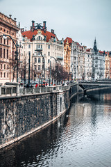 Fototapeta na wymiar River Vltava with buildings in Prague