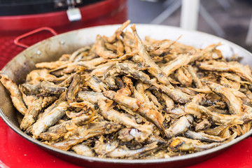 Food and meal concept - Grilled fish on the street