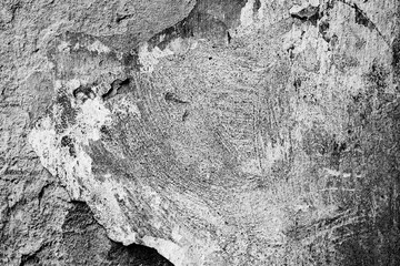 Texture of a concrete wall with cracks and scratches which can be used as a background