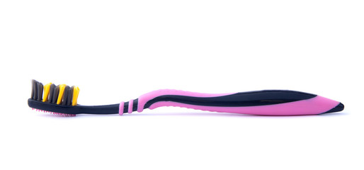 Black-pink toothbrush on isolated white background