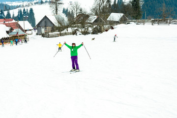 A man is skiing in the Carpathian village.