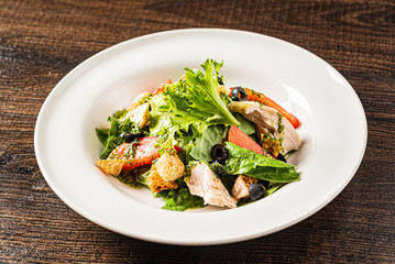 greek salad on the wooden background