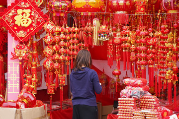 woman buying Lantern and good luck symbols,,Chinese calligraphy Translation:good bless for new year