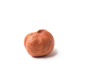 one peeled hazelnut core close-up, isolate white background