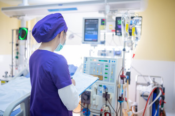 The specialist are checking continuous renal replacement therapy equipment and injection pump and...