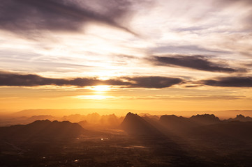 Beautiful Asian limestone mountain landscape sunrise at Pha Nok An cliff in Phu Kradueng National park. Loei - Thailand