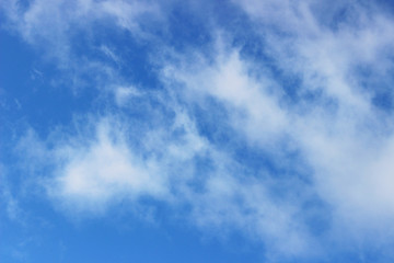 blue sky is covered by white clouds