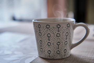 hot cup of coffee with steam