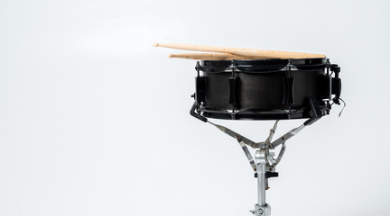 Fototapeta na wymiar drum and drumsticks isolated on white background