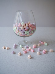 Gentle marshmallow in glass vase isolated on white