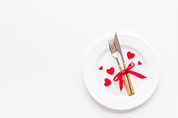 Valentines day table. Plate on white background top-down copy space