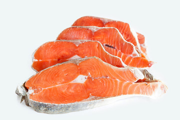 Delicious steaks of coho salmon fish after freezing before cooking in a restaurant or kitchen. Wholesome food and diet.