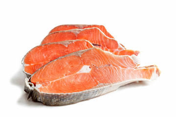 Delicious steaks of coho salmon fish after freezing before cooking in a restaurant or kitchen. Wholesome food and diet.