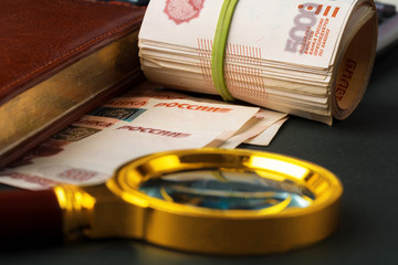 Magnifying Glass on the Russian Currency Rubles