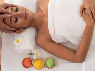 Top view Asian girls a relaxing facial massage in the Spa Salon. Thai massage for health