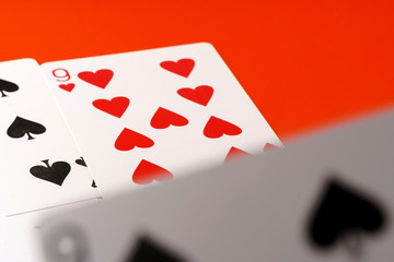 Playing cards on paper background close up