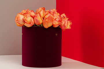 Hat box with beautiful bouquet of roses