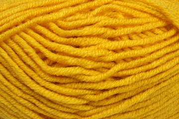 A tangle of mustard yellow threads close-up