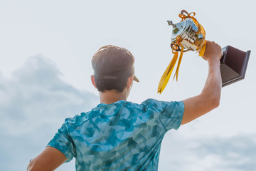 Athletes are lifting the trophy of success.