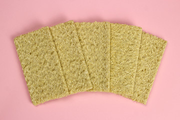 Spread out crispbread of corn on a pink background. Diet, proper nutrition, Vegan